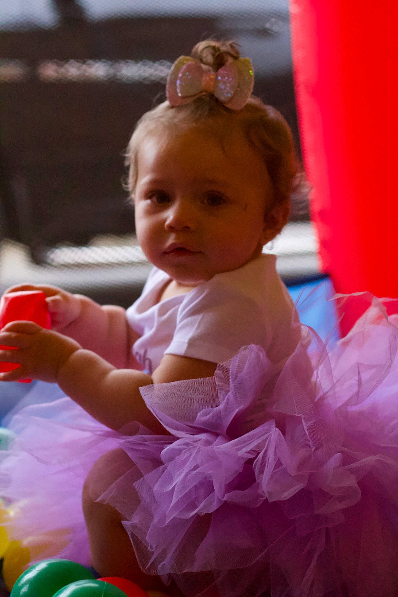 Amiyah is registered to the contest to win money with this photo: baby, baby_products, baby_toddler_clothing, ballet_tutu, child, dress, event, fun, hair_accessory, happy, headpiece, leisure, magenta, peach, person, pink, recreation, ruffle, sitting, smile