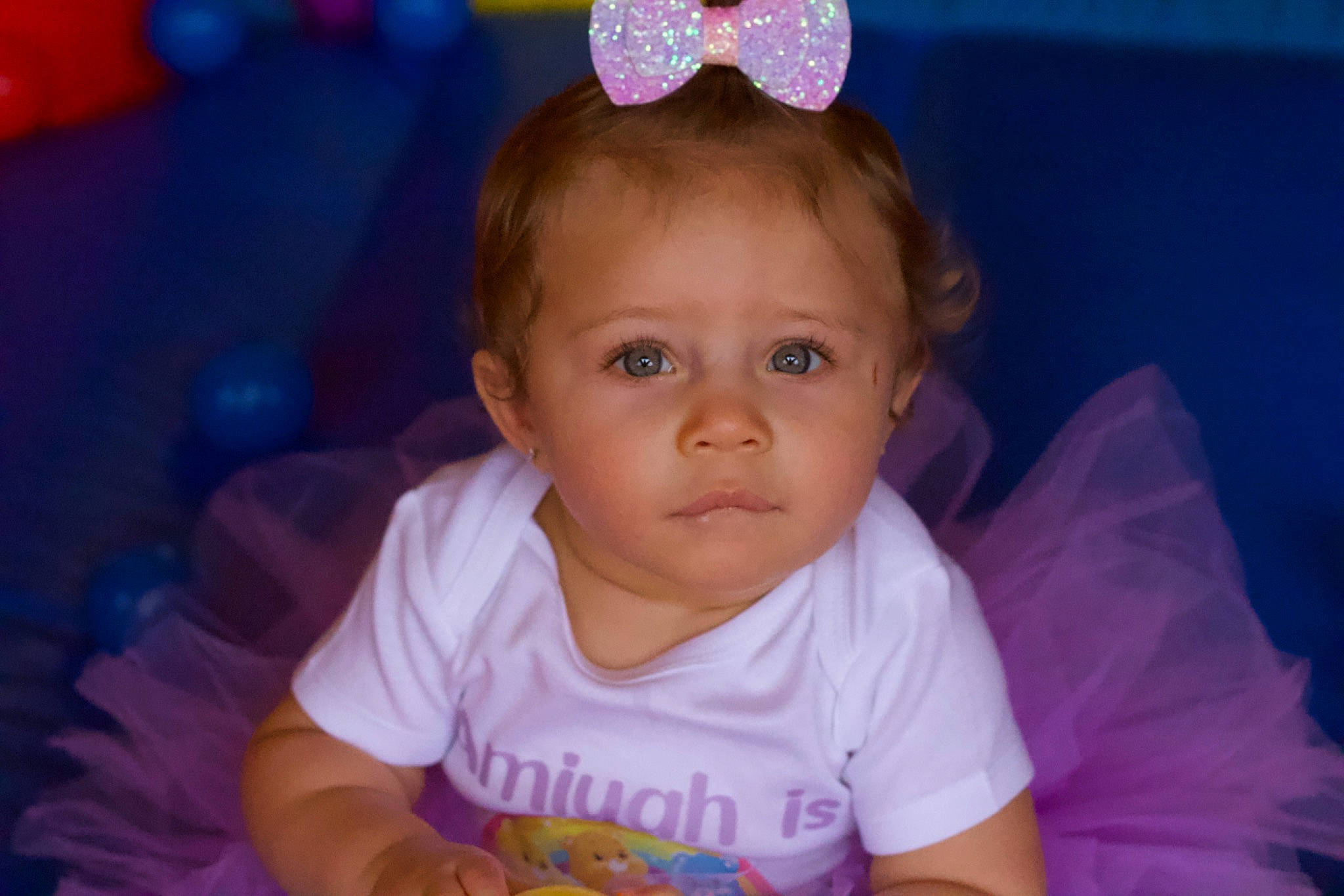 Amiyah is registered to the contest to win money with this photo: baby_toddler_clothing, blue, cheek, ear, eye, eyebrow, facial_expression, hair, hairstyle, happy, head, iris, lip, mouth, nose, organ, person, product, purple, skin