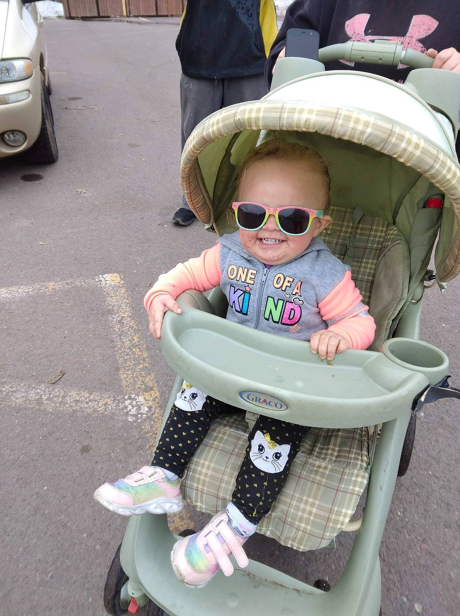 Amariah is registered to the contest to win money with this photo: asphalt, baby, baby_carriage, baby_toddler_clothing, child, eyewear, glasses, goggles, headgear, joy, people, person, photograph, product, smile, sunglasses, tire, toddler, vehicle_registration_plate, vision_care