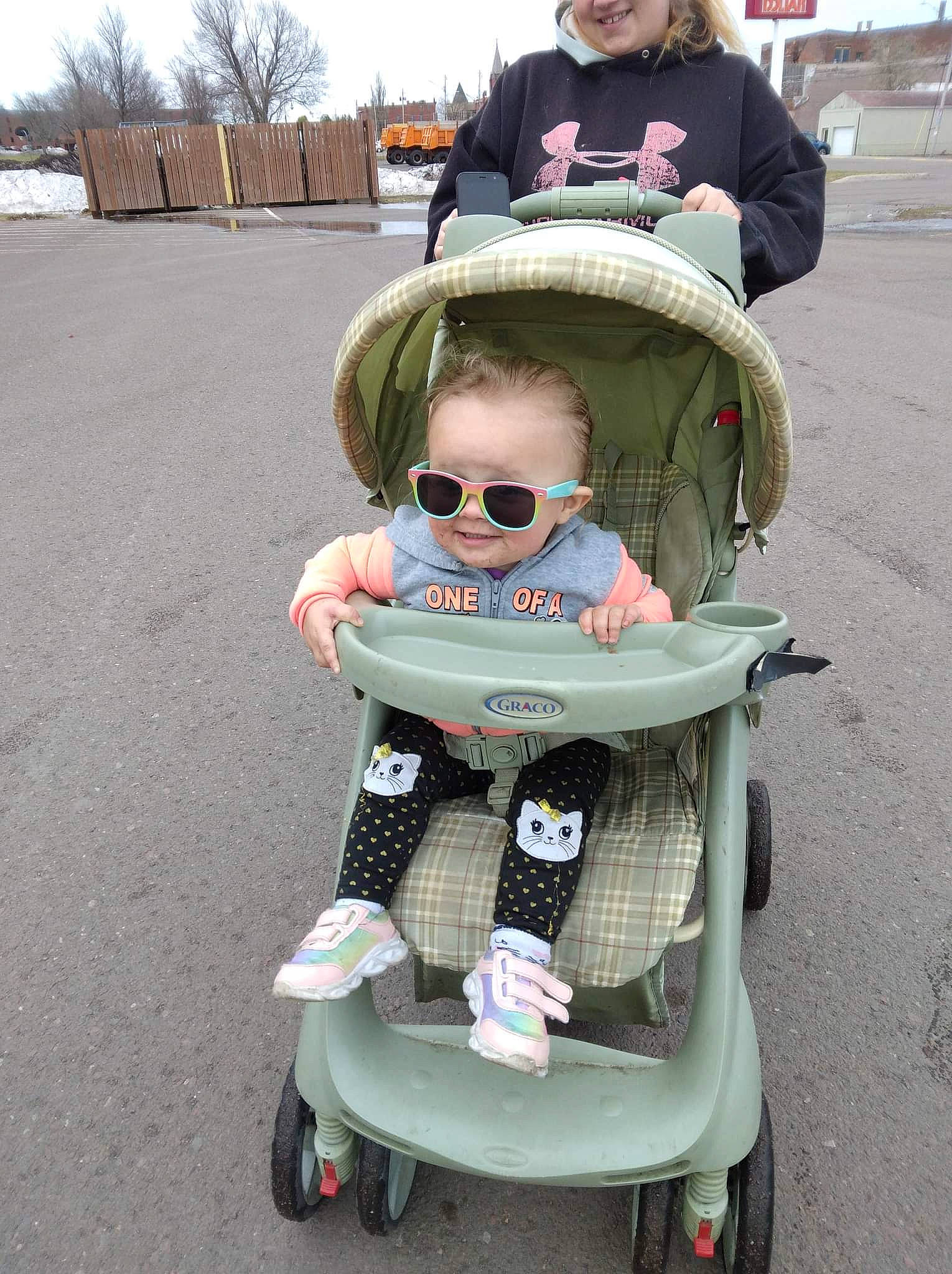 Amariah joined the competition — help win amazing prizes! baby, baby_carriage, baby_products, baby_toddler_clothing, child, eyewear, fun, goggles, green, person, personal_protective_equipment, photograph, recreation, sky, smile, sunglasses, tire, toddler, vision_care, wheel