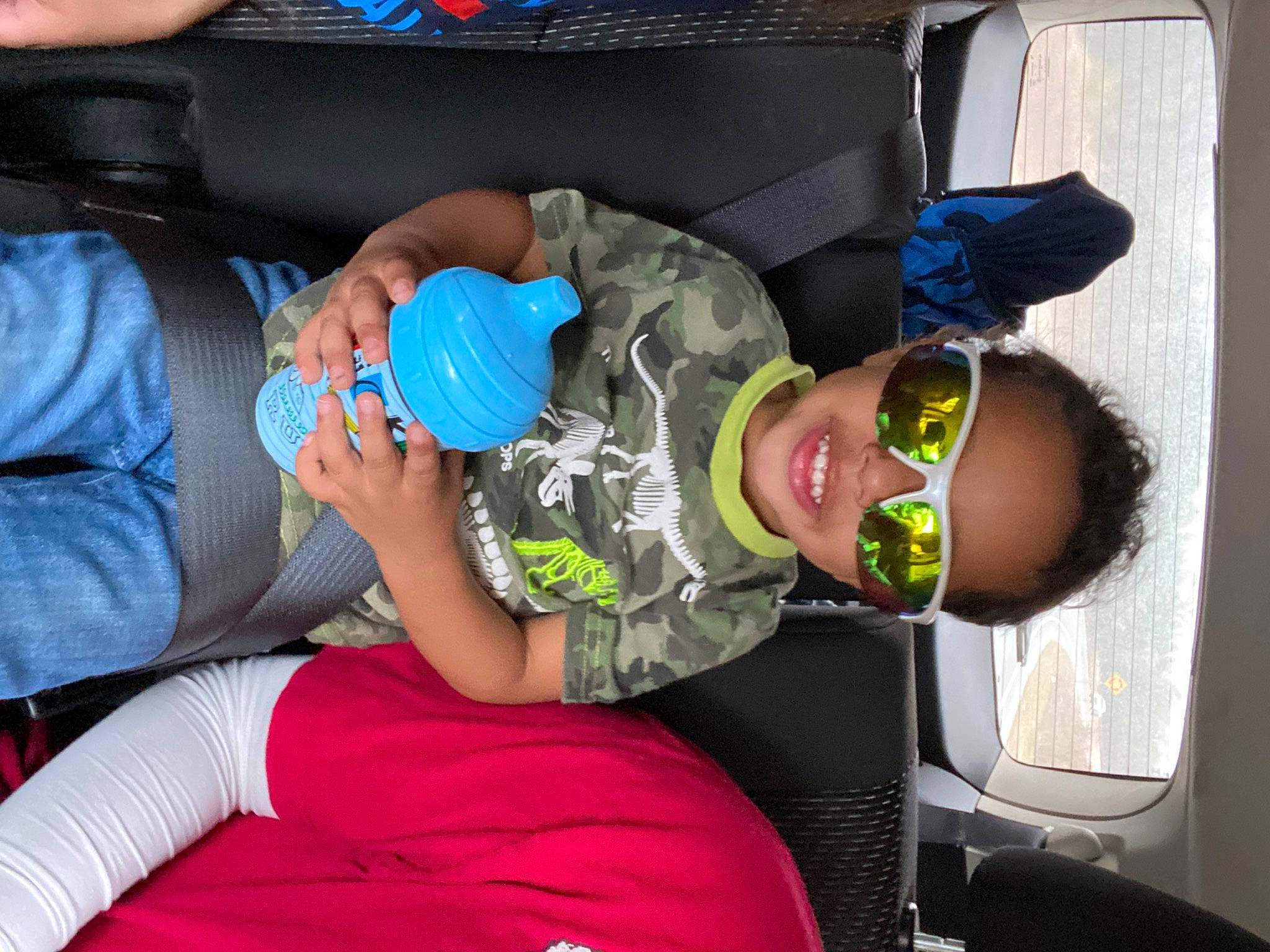 Braeson is registered to the contest to win money with this photo: baby, baby_products, baby_toddler_clothing, blue, child, comfort, electric_blue, fun, goggles, hat, joy, knee, person, personal_protective_equipment, room, smile, sunglasses, t_shirt, thigh, toddler