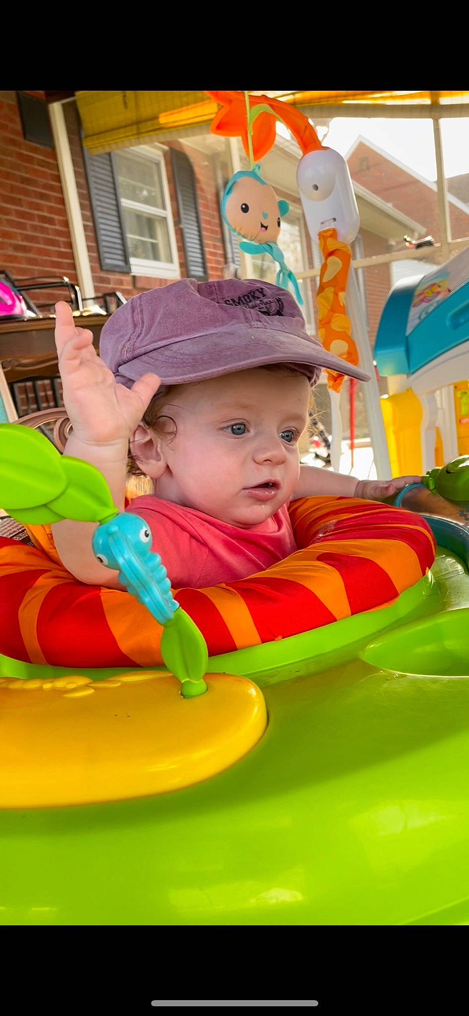 Daxx is registered to the contest to win money with this photo: baby, baby_playing_with_toys, baby_products, baby_toddler_clothing, baseball_cap, cap, child, event, fun, grass, happy, headwear, kindergarten, leisure, person, personal_protective_equipment, play, recreation, room, sitting