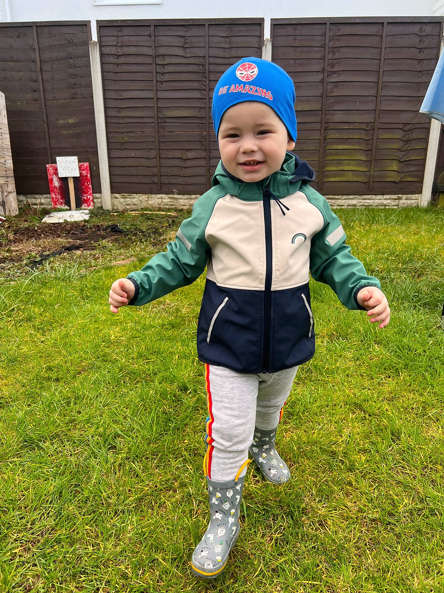 Arthur Mateo is registered to the contest to win money with this photo: baby_toddler_clothing, child, electric_blue, fun, grass, grassland, happy, headwear, holiday, jacket, joy, lawn, leisure, people_in_nature, person, personal_protective_equipment, plant, recreation, smile, sports_equipment
