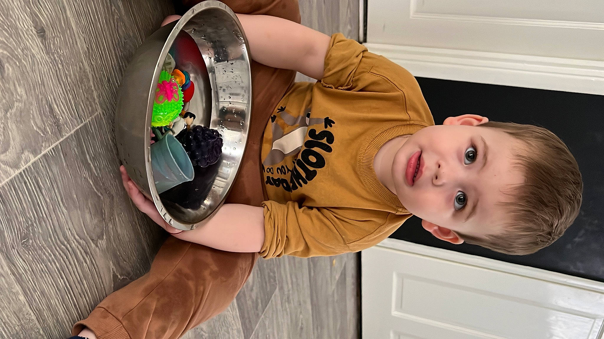 Arthur Mateo is registered to the contest to win money with this photo: audio_equipment, auto_part, automotive_wheel_system, baby_toddler_clothing, bicycle_tire, child, circle, elbow, fun, happy, mechanical_fan, person, room, smile, t_shirt, thigh, toddler, toy, wheel, window