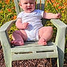baby, child, flower, orange_lilies, green_chair, outdoor, garden, sunlight, smiling, nature, plants, grass, summer, happy, person, sitting, infant, daylight, flora, wood_chips