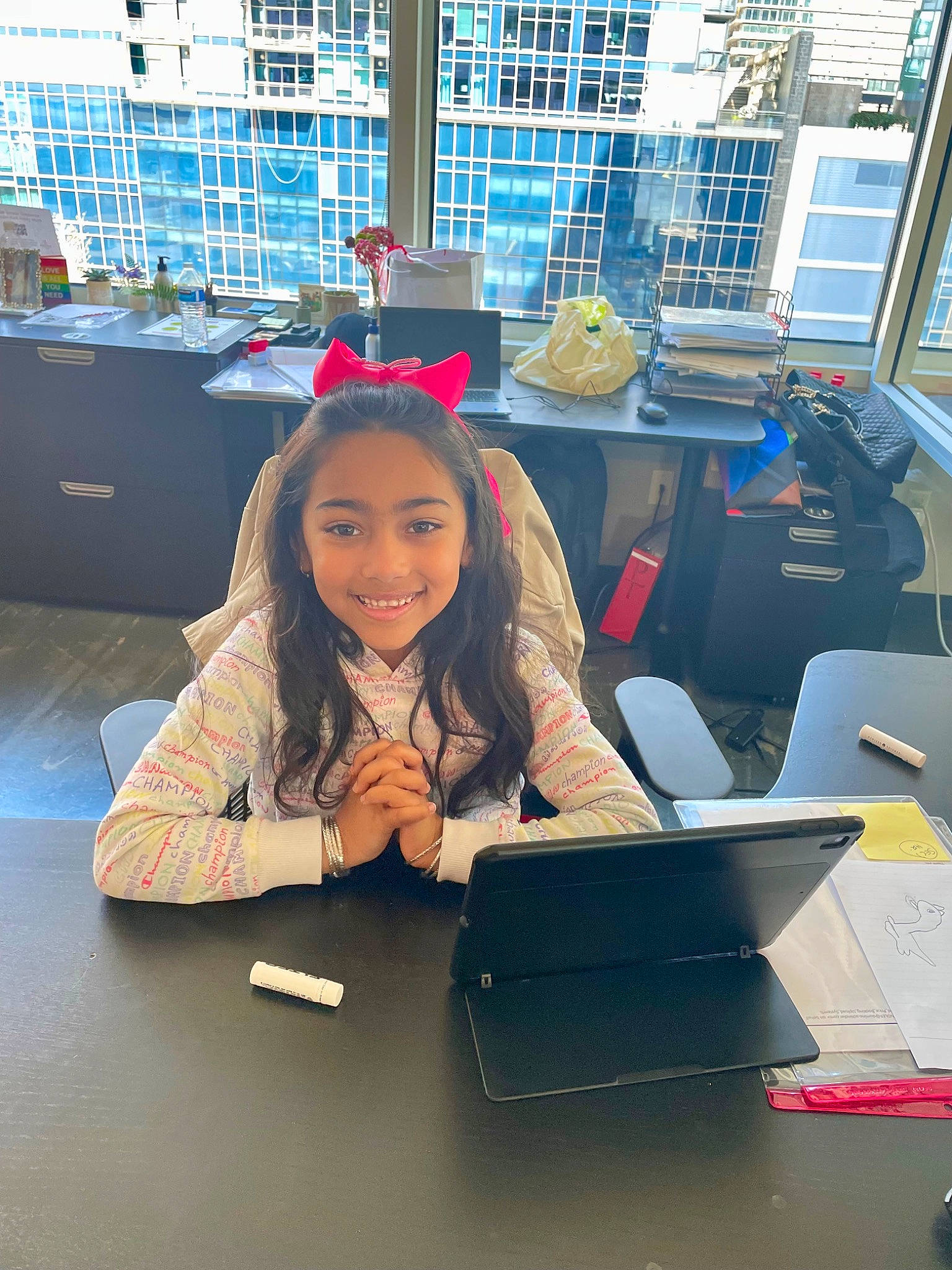 Chanel is registered to the contest to win money with this photo: aerospace_engineering, automotive_design, chair, computer, desk, employment, engineering, eyewear, fashion_design, fun, job, joy, laptop, luxury_vehicle, person, personal_computer, room, smile, table, travel