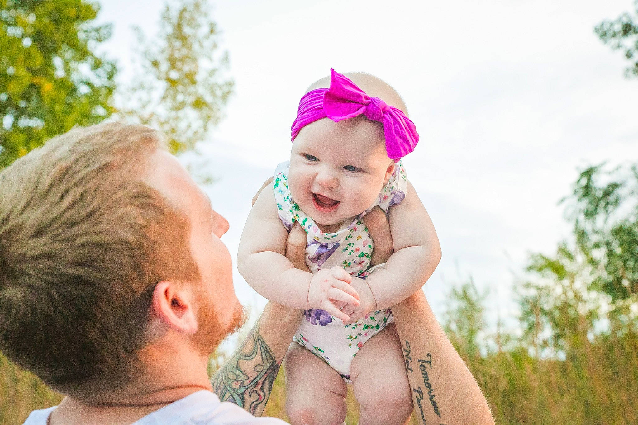 Phoebe is registered to the contest to win money with this photo: baby, cap, child, facial_expression, fun, grass, happy, hat, headgear, headwear, leisure, people_in_nature, person, plant, recreation, skin, sky, smile, sun_hat, sunlight