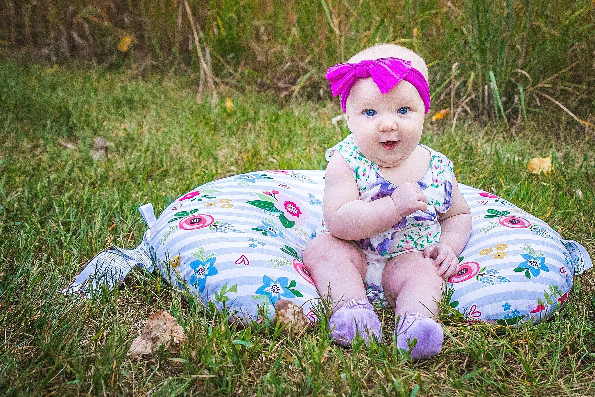 Phoebe joined the competition — help win amazing prizes! baby, baby_toddler_clothing, child, electric_blue, flash_photography, fun, grass, grass_family, grassland, happy, headwear, lawn, meadow, pattern, people_in_nature, person, personal_protective_equipment, plant, sitting, smile