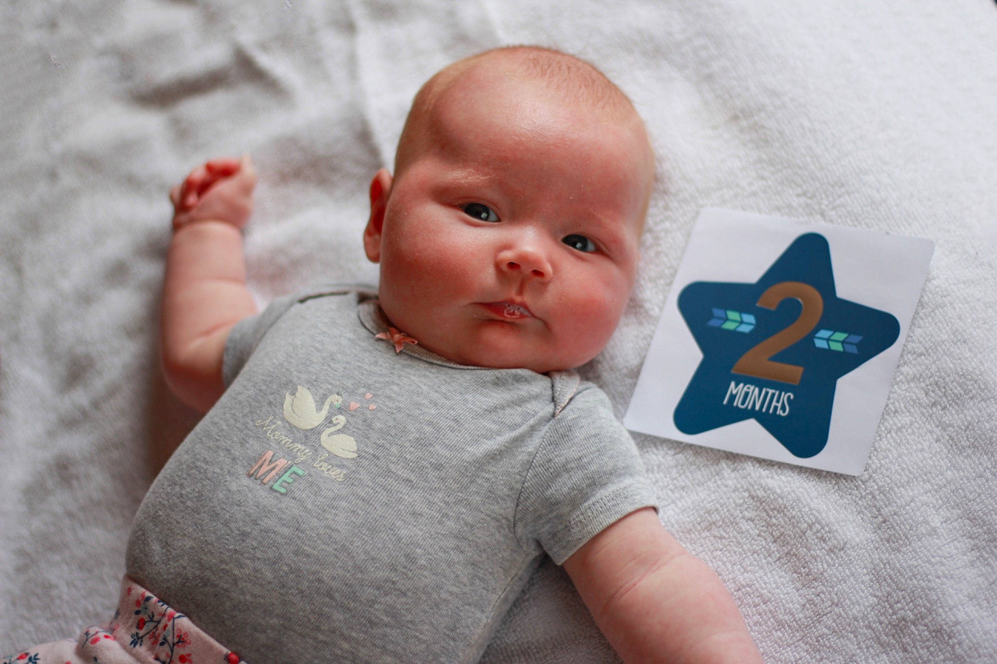 Océane a rejoint le concours — aidez-le/la à gagner de superbes lots ! baby, baby_products, baby_toddler_clothing, cheek, child, comfort, gesture, happy, linens, logo, pattern, person, portrait_photography, skin, sleeve, t_shirt, toddler