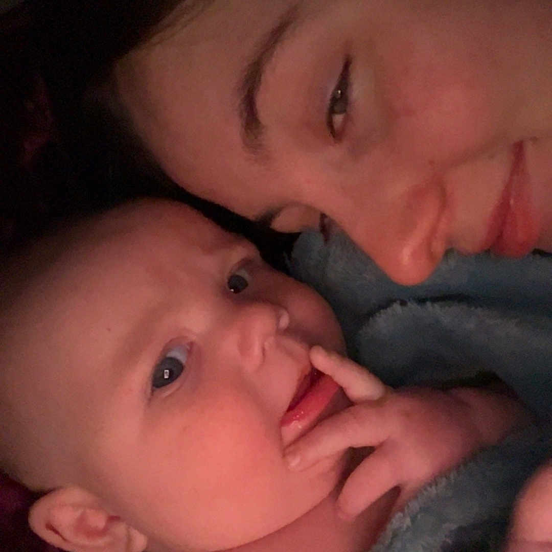 Colt is registered to the contest to win money with this photo: baby, bed, bedroom, blanket, bodypart, face, furniture, happy, head, indoors, laughing, mouth, newborn, person, photography, portrait, room, selfie, sleeping, smile