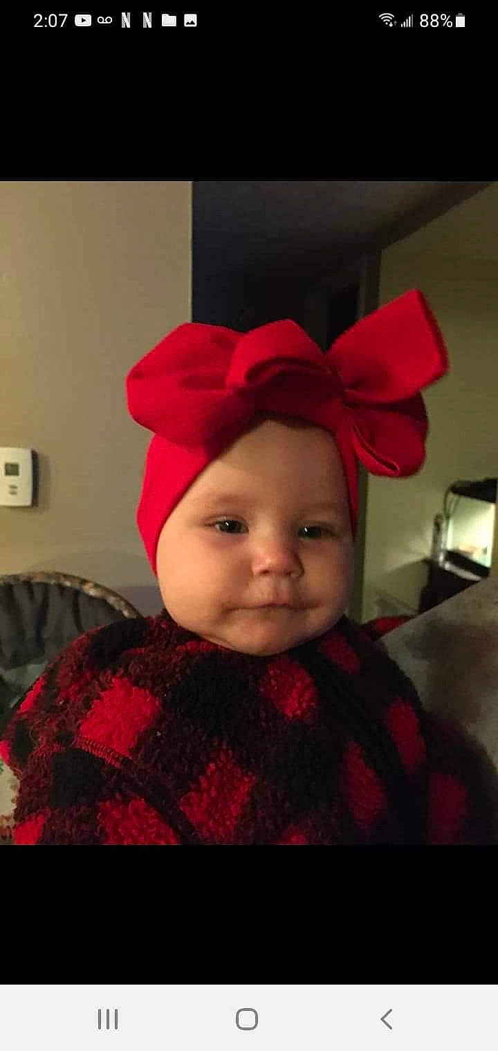 Raelyn joined the competition — help win amazing prizes! baby, baby_toddler_clothing, cap, costume_hat, dress, ear, event, eyebrow, fashion_accessory, happy, hat, headgear, headwear, knit_cap, lip, magenta, pattern, person, pink, red