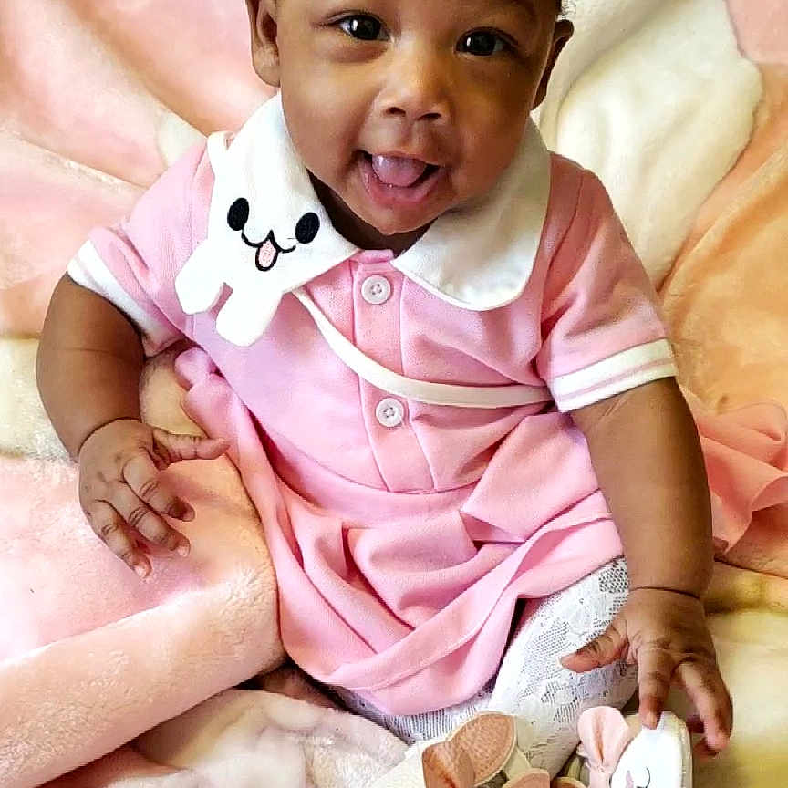 Nikita is registered to the contest to win money with this photo: accessories, baby, babylaughing, clothing, couch, cushion, face, furniture, happy, head, homedecor, indoors, jewelry, necklace, person, photography, portrait, sitting, smile, t_shirt