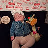 Hazel is registered to the contest to win money with this photo: baby, infant, sleeping, portrait, four_months, bow_headband, denim_jacket, pink_pants, plush_toy, giraffe, milestone_photo, blanket, cherries, bows, couch, indoor, sitting, closed_eyes, child, cozy