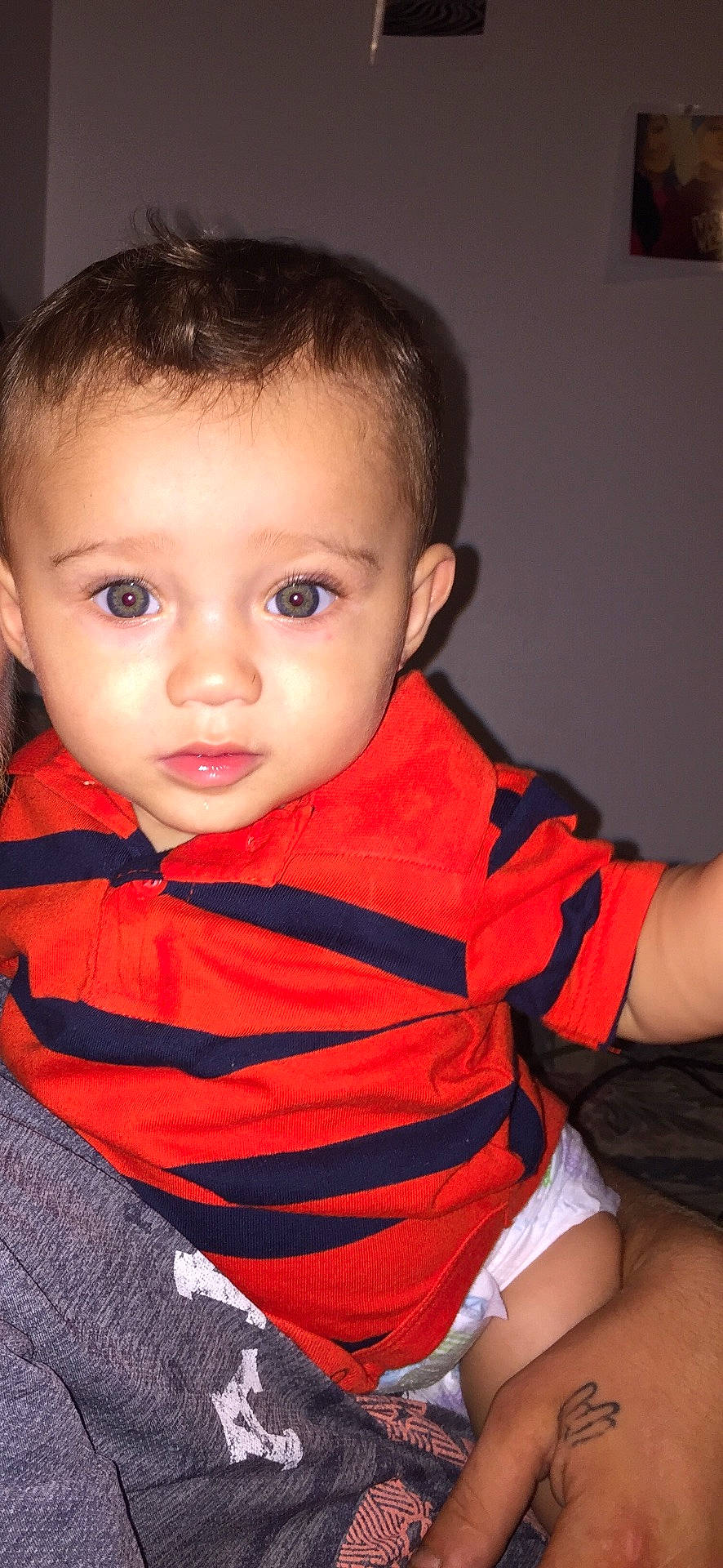 Kellan is registered to the contest to win money with this photo: boy, cheek, child, chin, eye, face, head, human, infant, lip, mouth, nose, person, red, sitting, skin, smile, standing, textile, toddler