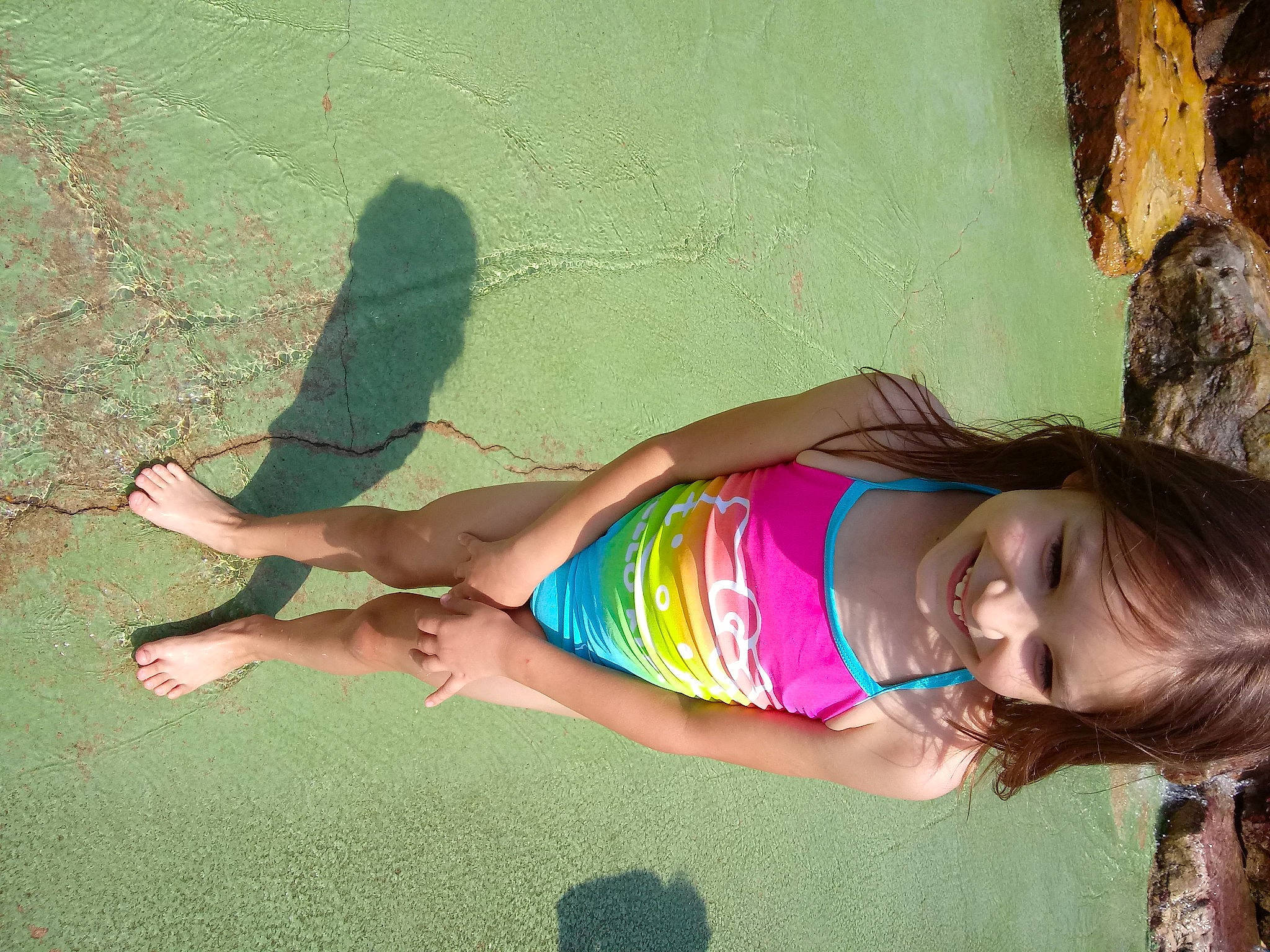 Nataly is registered to the contest to win money with this photo: adaptation, elbow, face, fun, grass, hairstyle, happy, head, joy, knee, leaf, leg, leisure, mammal, people_in_nature, person, pink, smile, thigh, tints_and_shades