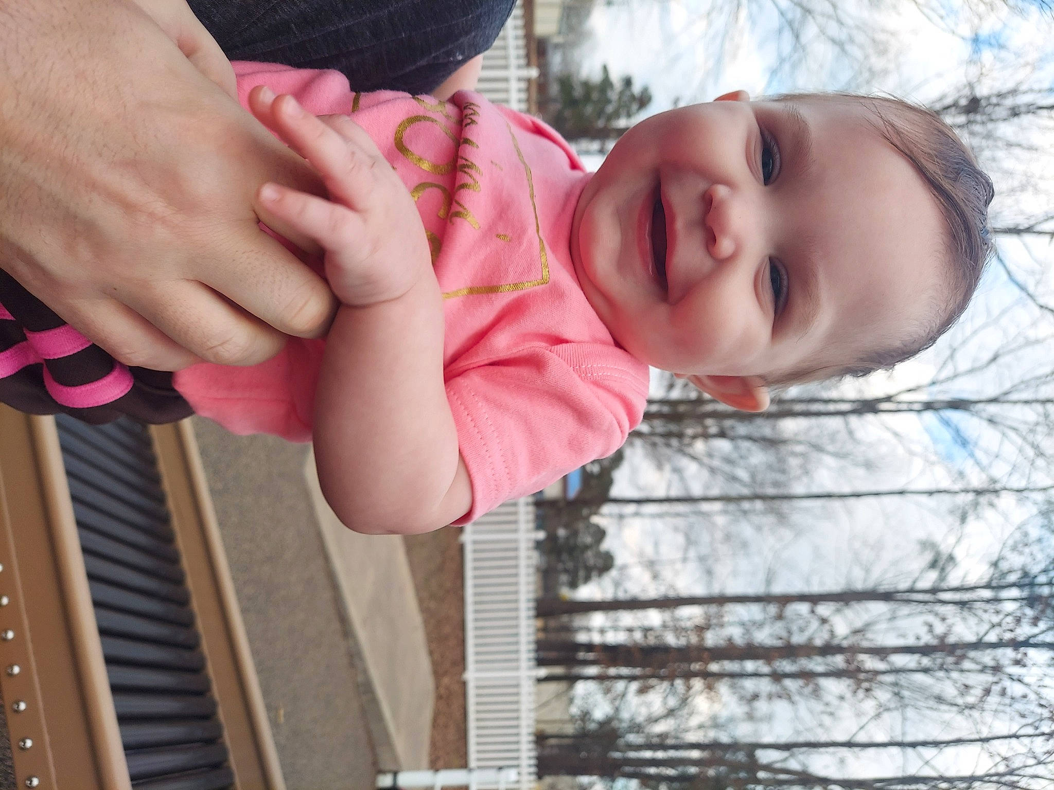 Lilyth is registered to the contest to win money with this photo: baby, cool, facial_expression, finger, gesture, hand, happy, human_body, joy, lip, mouth, people_in_nature, person, photograph, pink, plant, skin, smile, toddler, tree