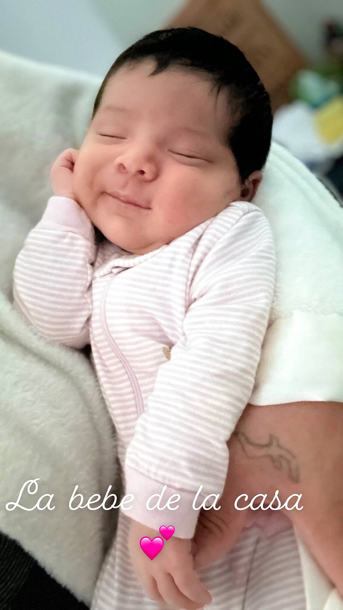 Evelynn is registered to the contest to win money with this photo: baby, baby_toddler_clothing, cheek, child, collar, comfort, eyelash, face, flash_photography, gesture, happy, linens, nose, pattern, person, portrait_photography, skin, sleeve, smile, thumb