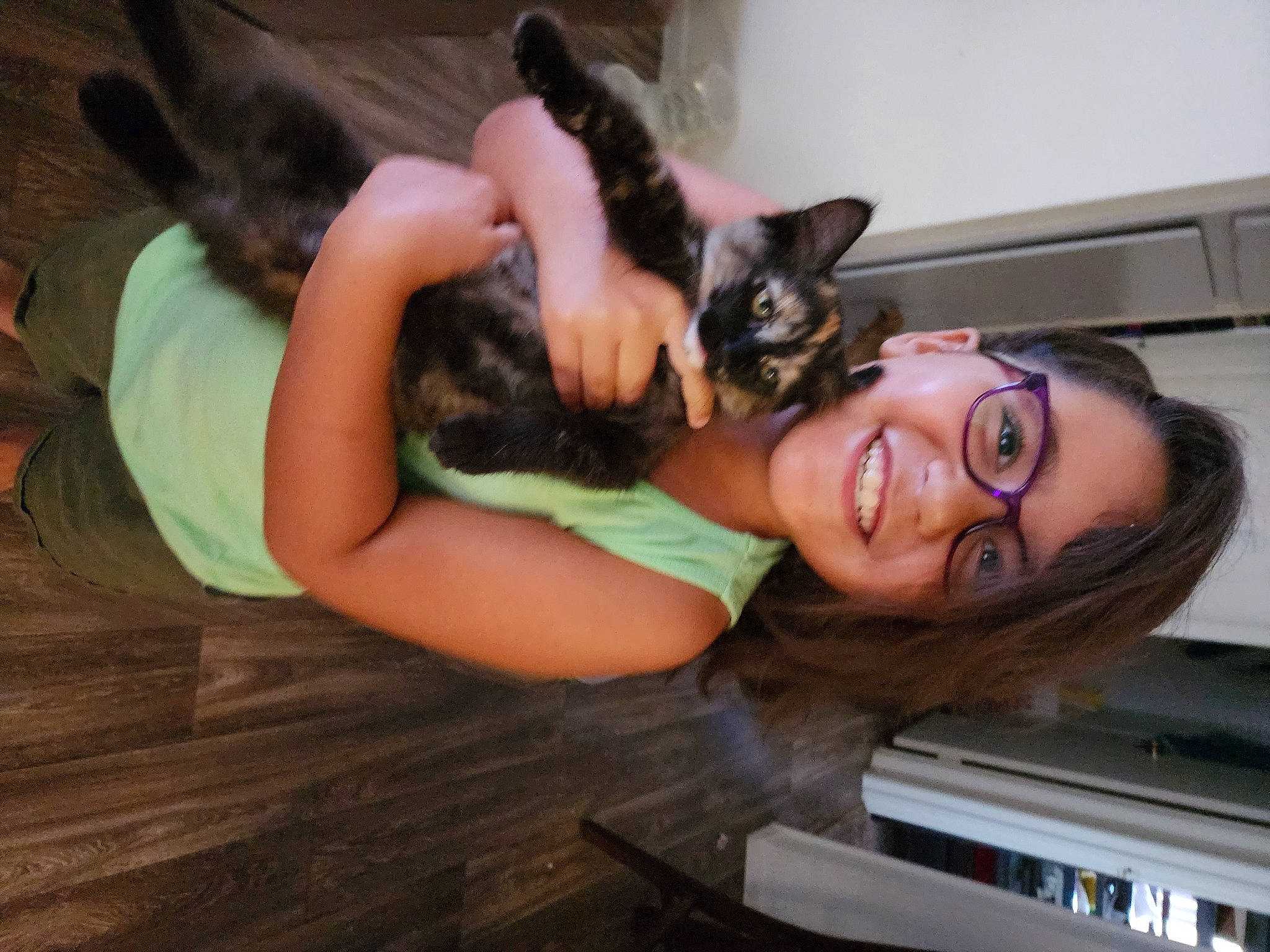 Lucy is registered to the contest to win money with this photo: black_hair, carnivore, clothing, comfort, companion_dog, dog, dog_breed, eyewear, fawn, felidae, glasses, happy, human_leg, joy, long_hair, mammal, person, smile, sunglasses, thigh