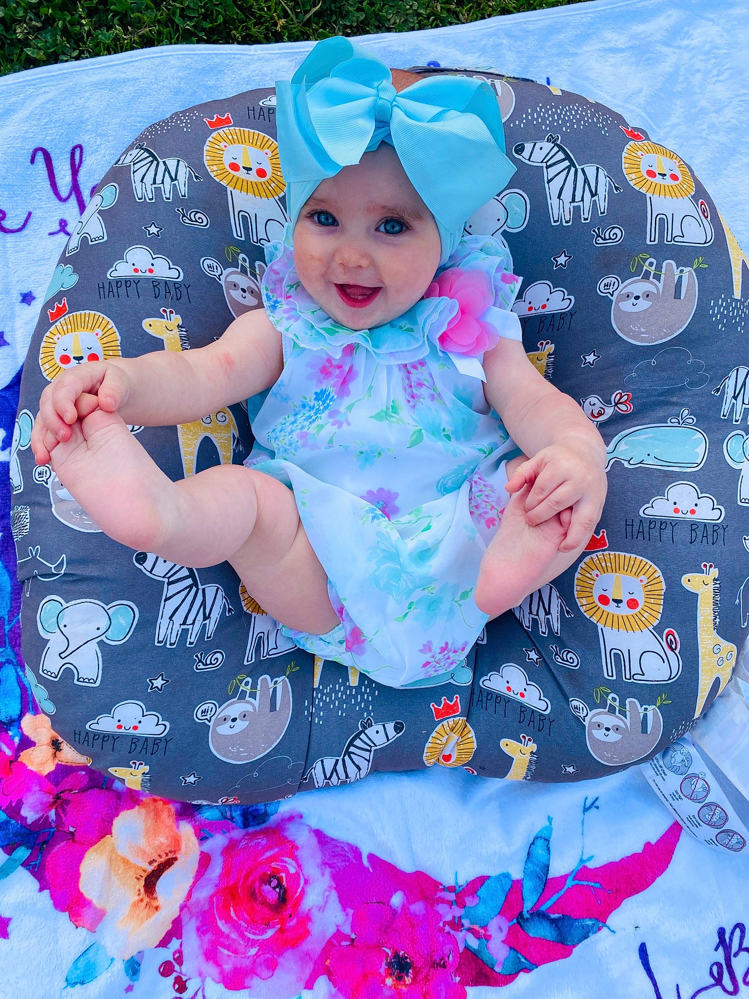 Brinlee is registered to the contest to win money with this photo: aqua, baby, baby_products, baby_toddler_clothing, blue, child, electric_blue, fun, happy, hat, headgear, headwear, magenta, pattern, person, petal, pink, purple, smile, textile