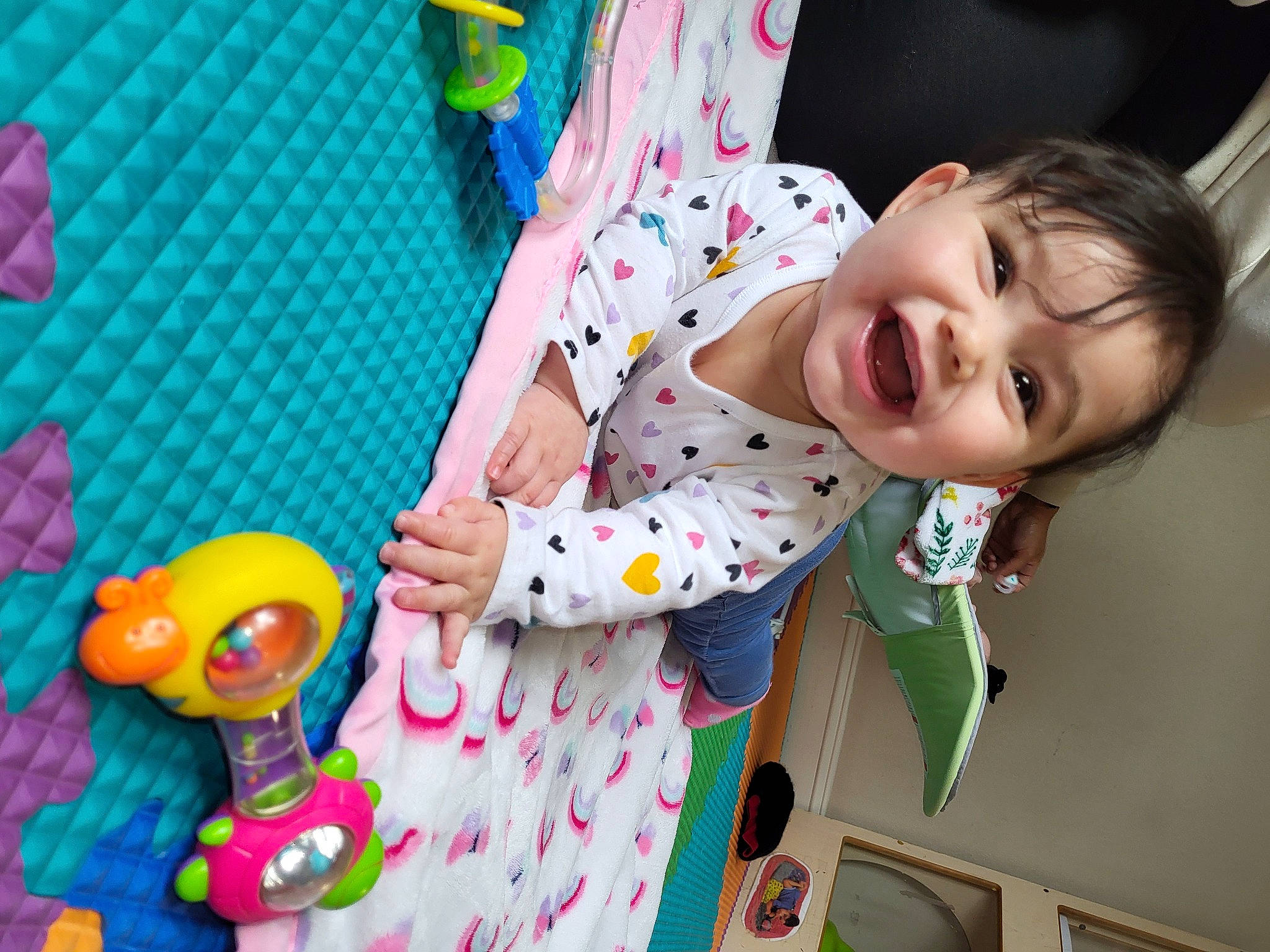 Emma joined the competition — help win amazing prizes! baby, baby_playing_with_toys, baby_products, baby_toddler_clothing, baby_toys, child, fun, green, happy, leisure, pattern, person, pink, play, product, room, smile, stuffed_toy, textile, toddler