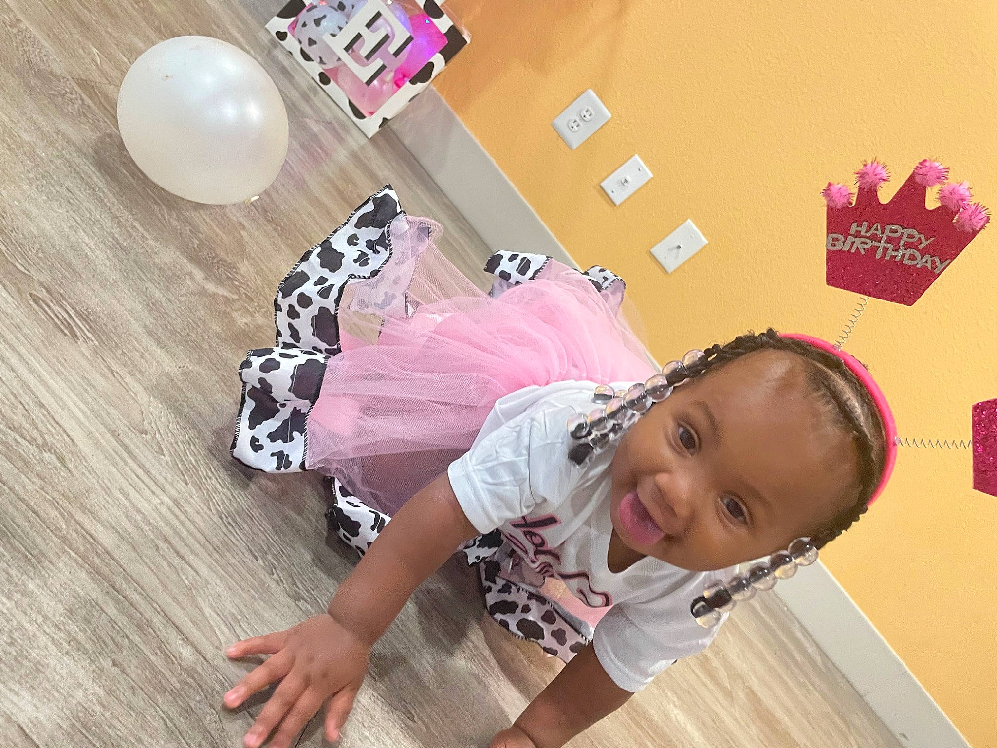 Amani joined the competition — help win amazing prizes! baby, baby_toddler_clothing, balloon, child, flooring, font, fun, happy, hardwood, magenta, party_supply, pattern, person, pink, play, room, smile, t_shirt, thigh, toddler