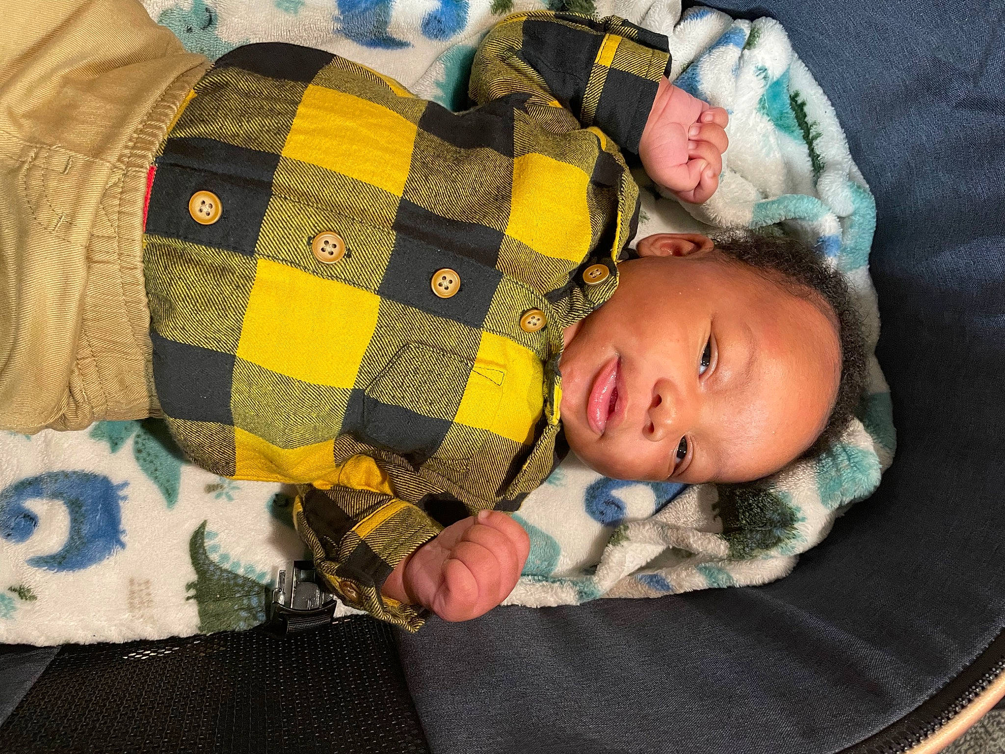 Caisyn is registered to the contest to win money with this photo: baby, baby_toddler_clothing, bedtime, child, comfort, eye, face, grass, linens, pattern, person, plaid, room, sitting, skin, sleeve, tartan, textile, toddler, wood