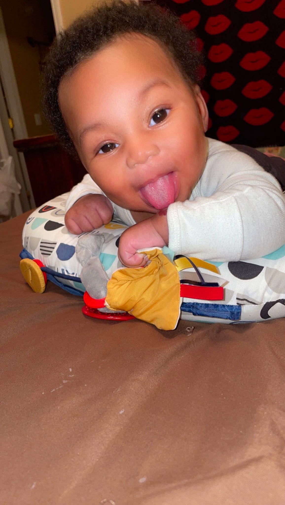 Caisyn is registered to the contest to win money with this photo: baby, baby_playing_with_toys, baby_products, baby_toddler_clothing, baby_toys, cheek, chin, eye, face, facial_expression, finger, flooring, fun, head, mouth, nose, person, sitting, skin, toddler