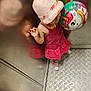 Thaïssya participe au concours pour gagner de l'argent avec cette photo : balloon, child, colorful, cute, elevator, floor, hand, indoor, metal_wall, patterned_floor, person, pink_dress, playful, reflection, shoes, standing, sunhat, toddler, toy, unicorn