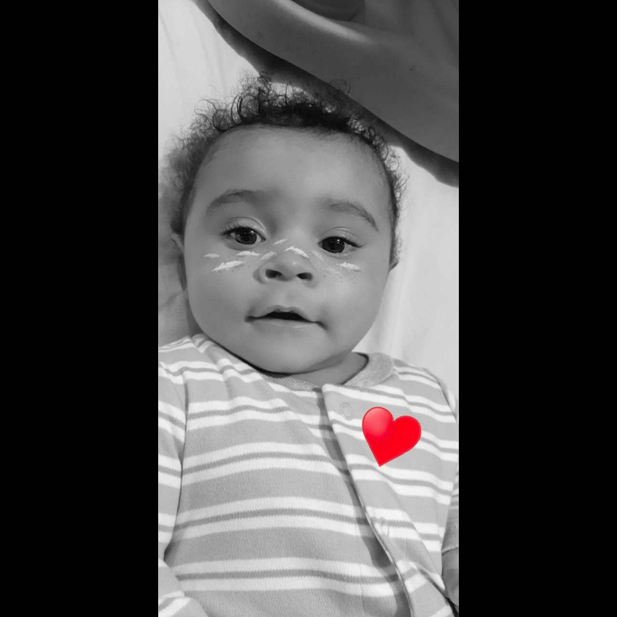 Jessiah is registered to the contest to win money with this photo: baby, black_and_white, cheek, child, chin, eye, face, facial_expression, forehead, head, iris, lip, nose, person, photograph, photography, skin, snapshot, standing, toddler