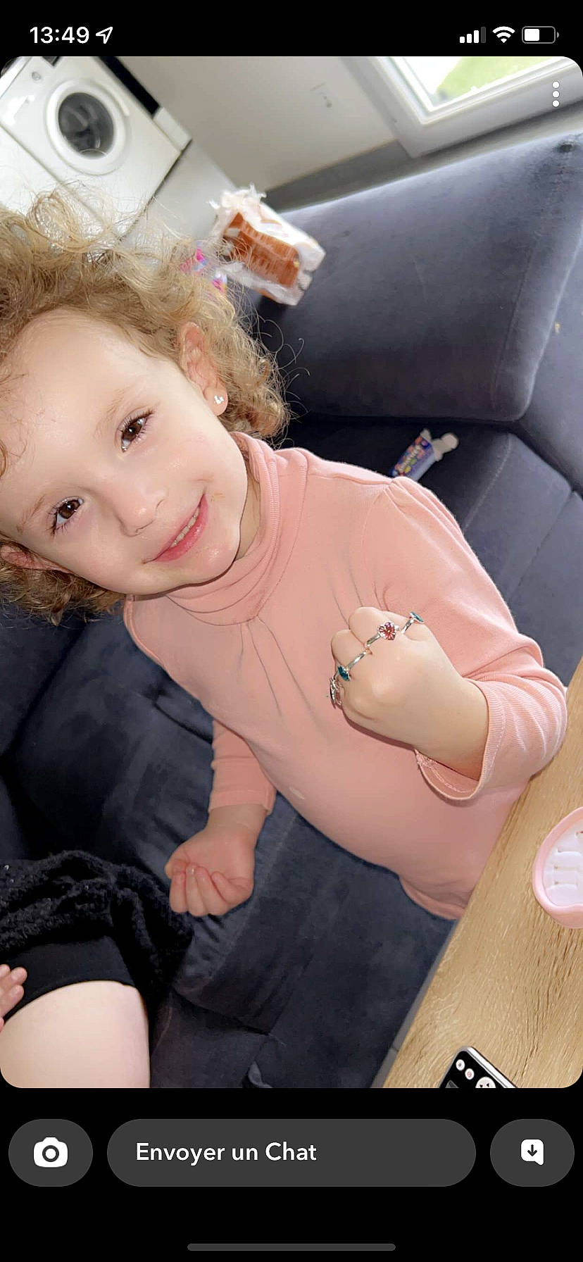 Lyliana participe au concours pour gagner de l'argent avec cette photo : baby, car_seat, cheek, chest, child, comfort, finger, flash_photography, happy, human_leg, joy, lap, lip, mouth, person, pink, sitting, skin, smile, thigh