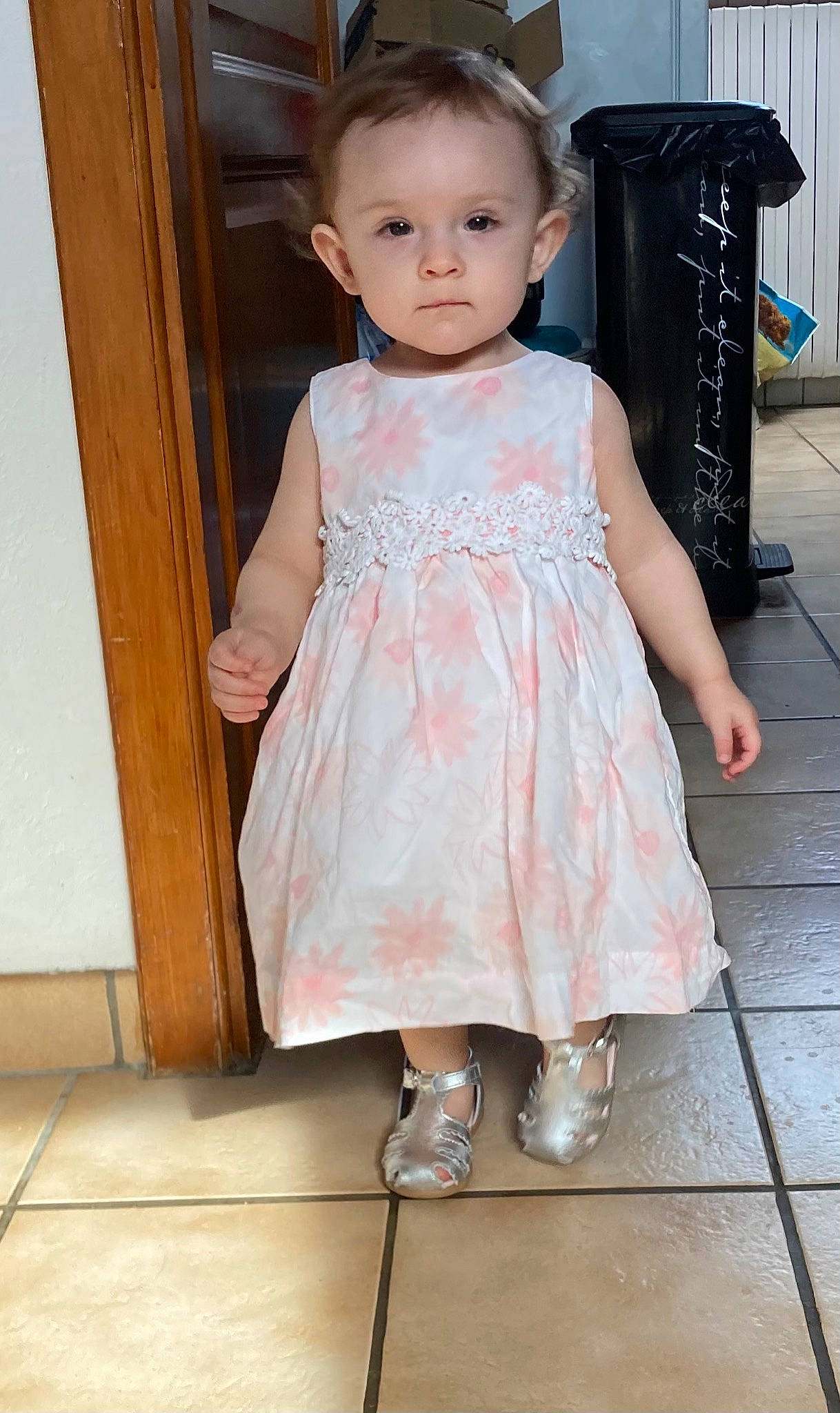 Lyliana participe au concours pour gagner de l'argent avec cette photo : baby_toddler_clothing, blond, child, cocktail_dress, day_dress, dress, floor, flooring, hardwood, human_leg, one_piece_garment, pattern, person, pink, sitting, skin, sleeve, toddler, waist, waste_container