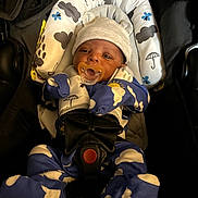 Devonta joined the competition — help win amazing prizes! baby, baby_clothes, bear_ears, blue_clothing, car_seat, child, cloud_pattern, cute, face, hat, headwear, indoors, infant, newborn, onesie, pacifier, portrait, seatbelt, sitting, sun_pattern