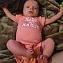 baby, infant, onesie, blanket, legs, arms, feet, face, clothing, soft, lying_down, cute, sleepy, indoors, child, newborn, skin, person, expression, resting