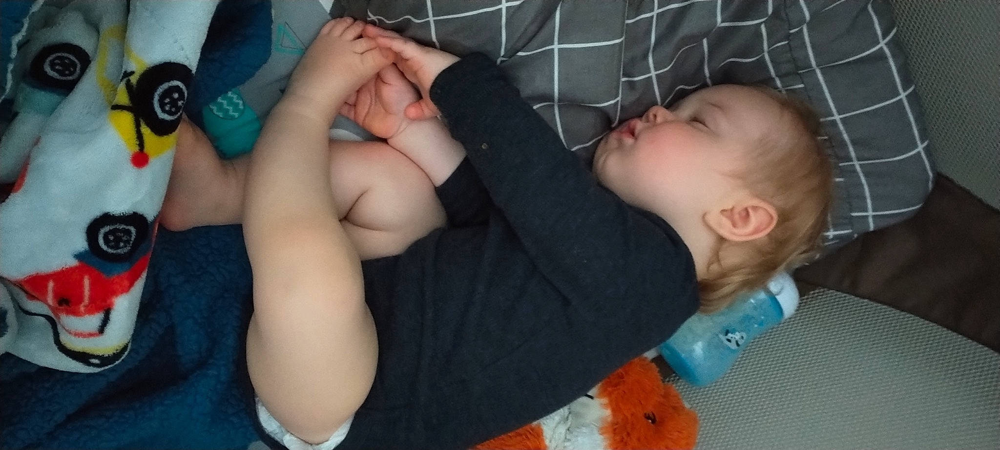 Lucius is registered to the contest to win money with this photo: arm, baby, baby_toddler_clothing, cheek, chest, comfort, elbow, finger, foot, gesture, hand, human_body, knee, mouth, nose, person, skin, thigh, thumb, toddler