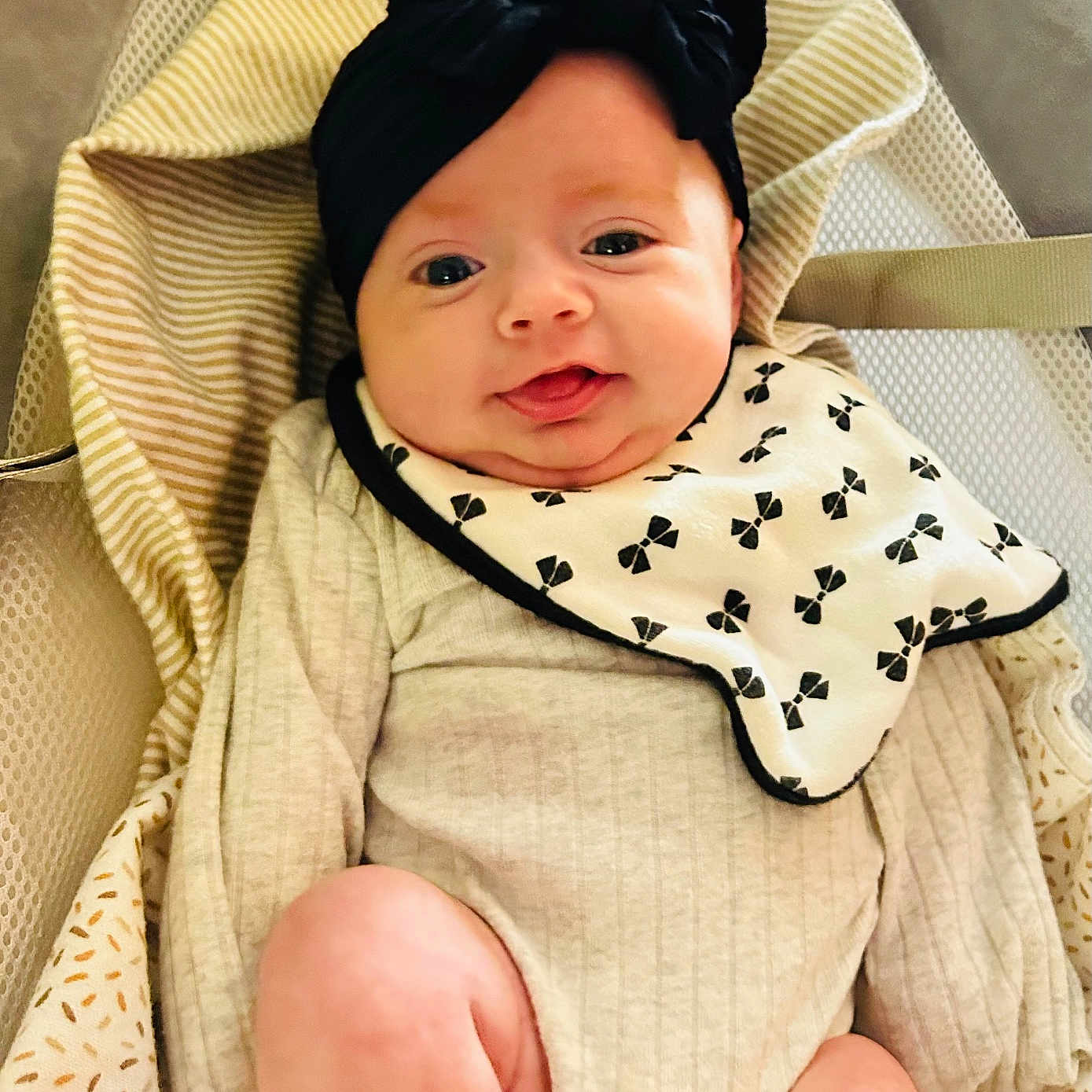 Marceline is registered to the contest to win money with this photo: baby, babylaughing, blanket, bonnet, clothing, cushion, face, happy, hat, head, homedecor, newborn, person, photography, portrait, smile