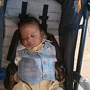 Ron joined the competition — help win amazing prizes! baby, sleeping, stroller, vest, pants, child, infant, seatbelt, comfort, peaceful, indoors, cute, portrait, young_child, resting, clothing, head, face, hands, footwear