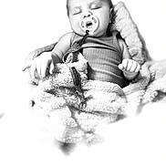 Paisley joined the competition — help win amazing prizes! baby, sleeping, pacifier, blanket, infant, soft_texture, black_and_white, closeup, peaceful, child, cute, wrapped, cozy, portrait, nursery, young_child, resting, indoors, comfort, serene