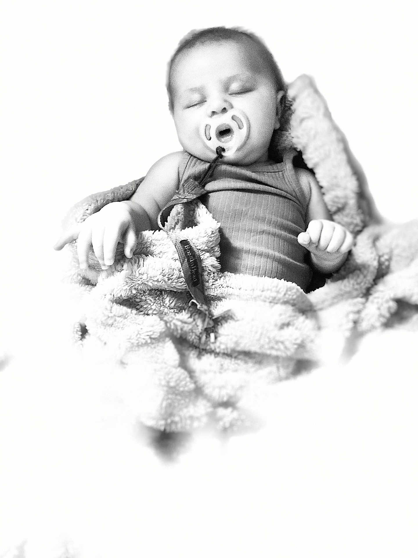 Paisley joined the competition — help win amazing prizes! baby, sleeping, pacifier, blanket, infant, soft_texture, black_and_white, closeup, peaceful, child, cute, wrapped, cozy, portrait, nursery, young_child, resting, indoors, comfort, serene