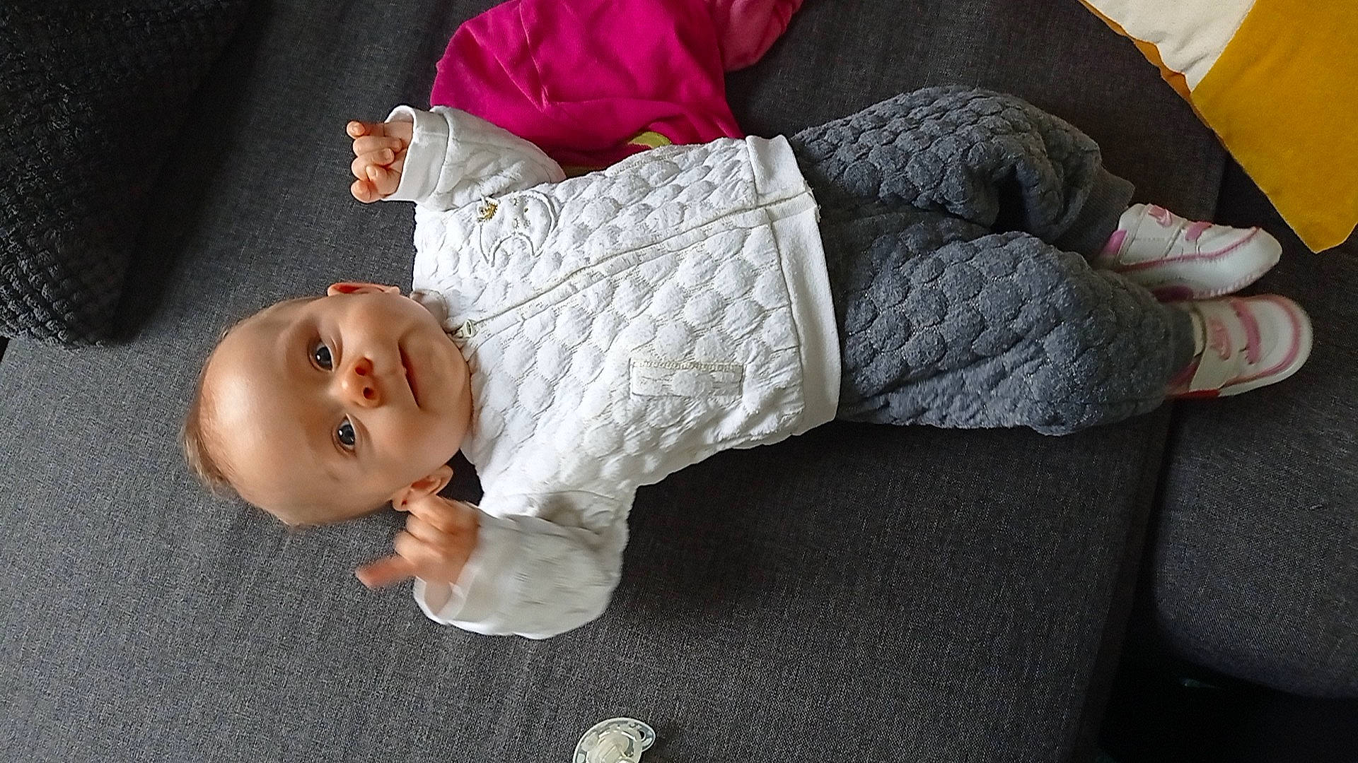 Eleana participe au concours pour gagner de l'argent avec cette photo : arm, baby, baby_toddler_clothing, cheek, comfort, dress, eye, facial_expression, finger, hand, head, headgear, human_body, joint, leg, mouth, nose, person, skin, sleeve