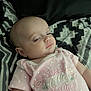 Jazlynn joined the competition — help win amazing prizes! baby, infant, pink_clothing, onesie, polka_dots, text_on_clothing, face, head, sleepy, blanket, patterned_blanket, close_up, portrait, child, young, skin, cute, resting, indoors, soft_light