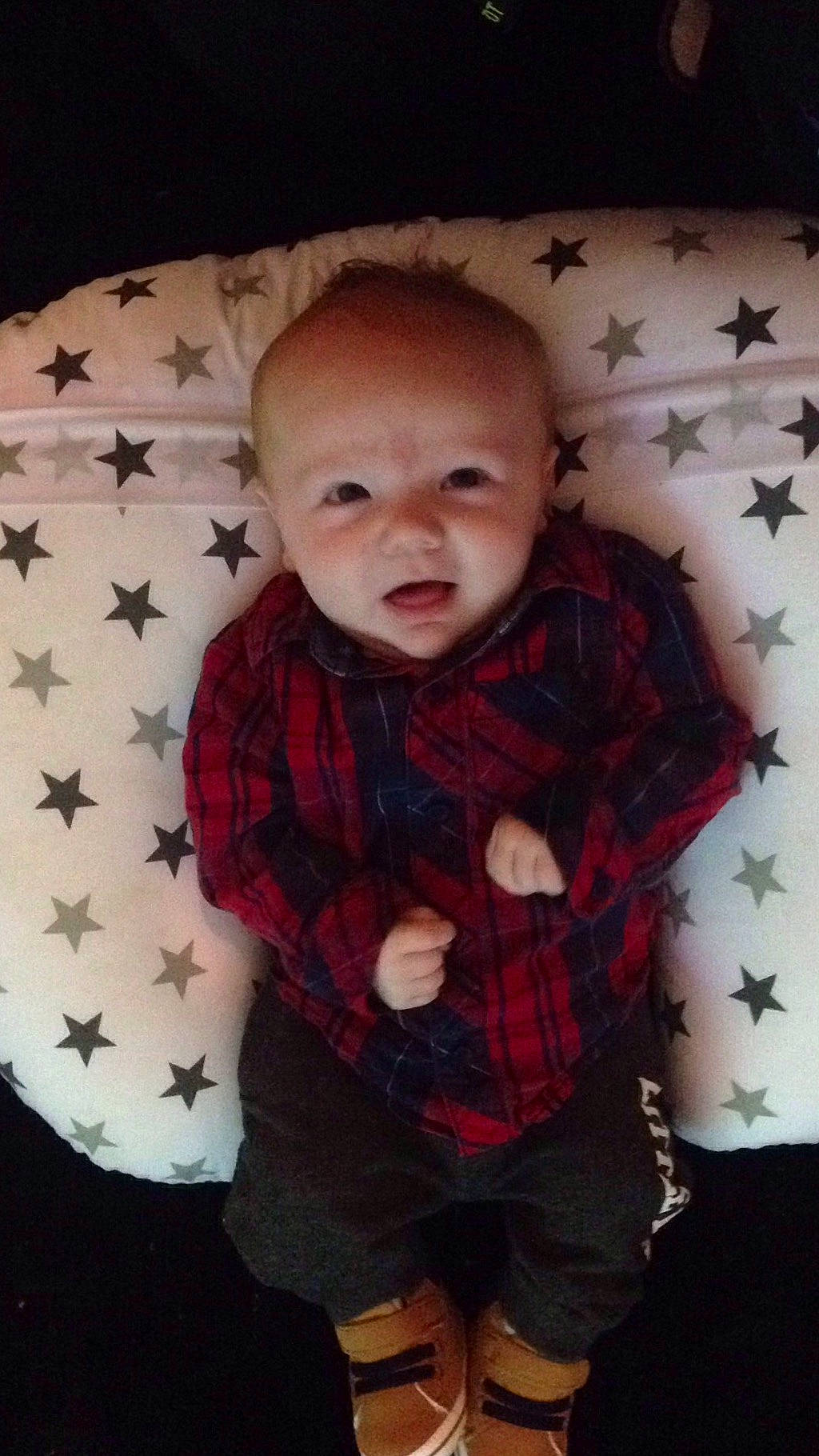 Ollie is registered to the contest to win money with this photo: baby, cheek, child, design, face, head, pattern, person, plaid, skin, sleeve, smile, tartan, textile, toddler