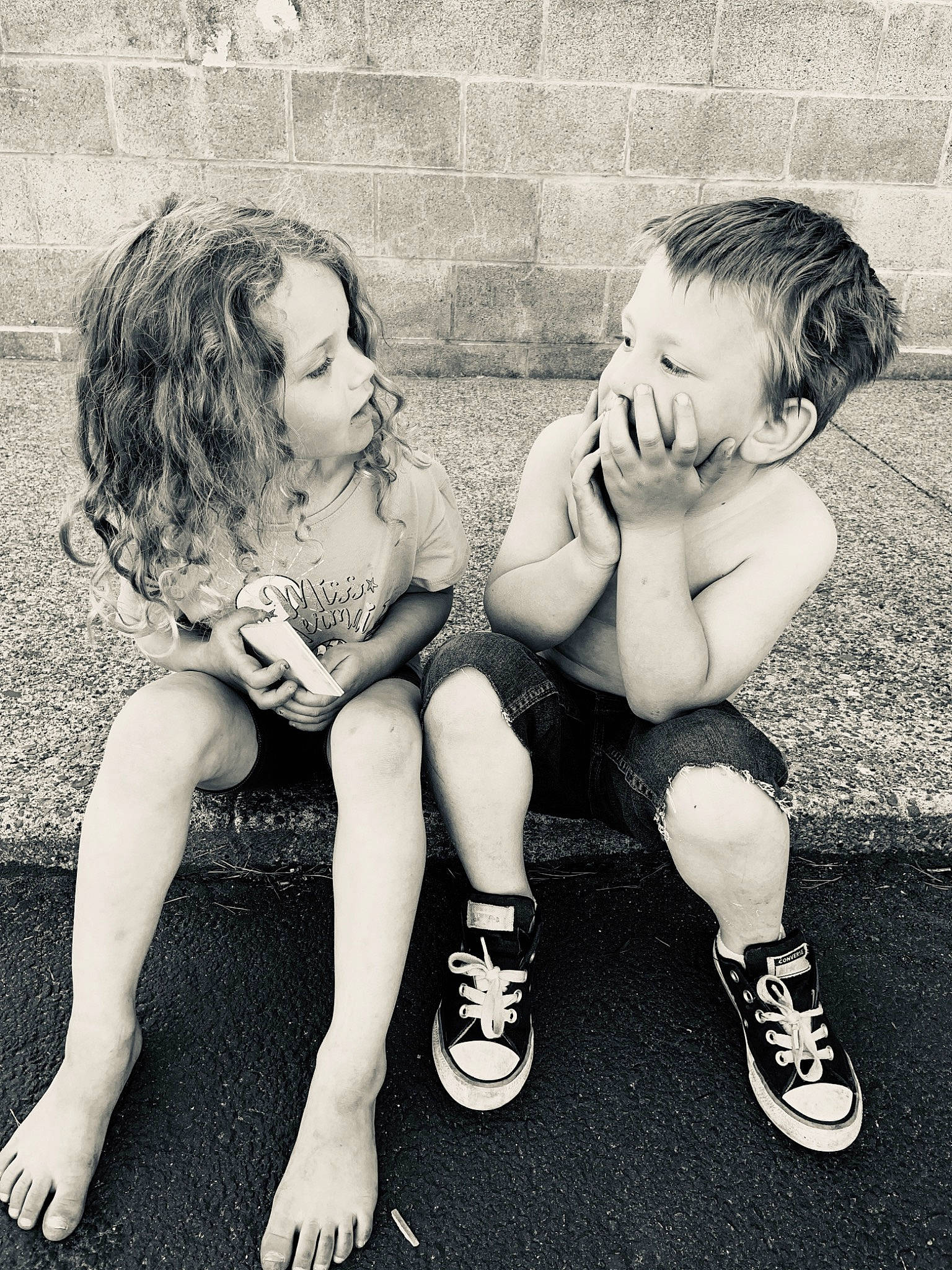 Kyah is registered to the contest to win money with this photo: black_and_white, child, facial_expression, footwear, friendship, fun, hand, happy, interaction, leg, monochrome, monochrome_photography, people, person, photograph, photography, play, sitting, smile, snapshot