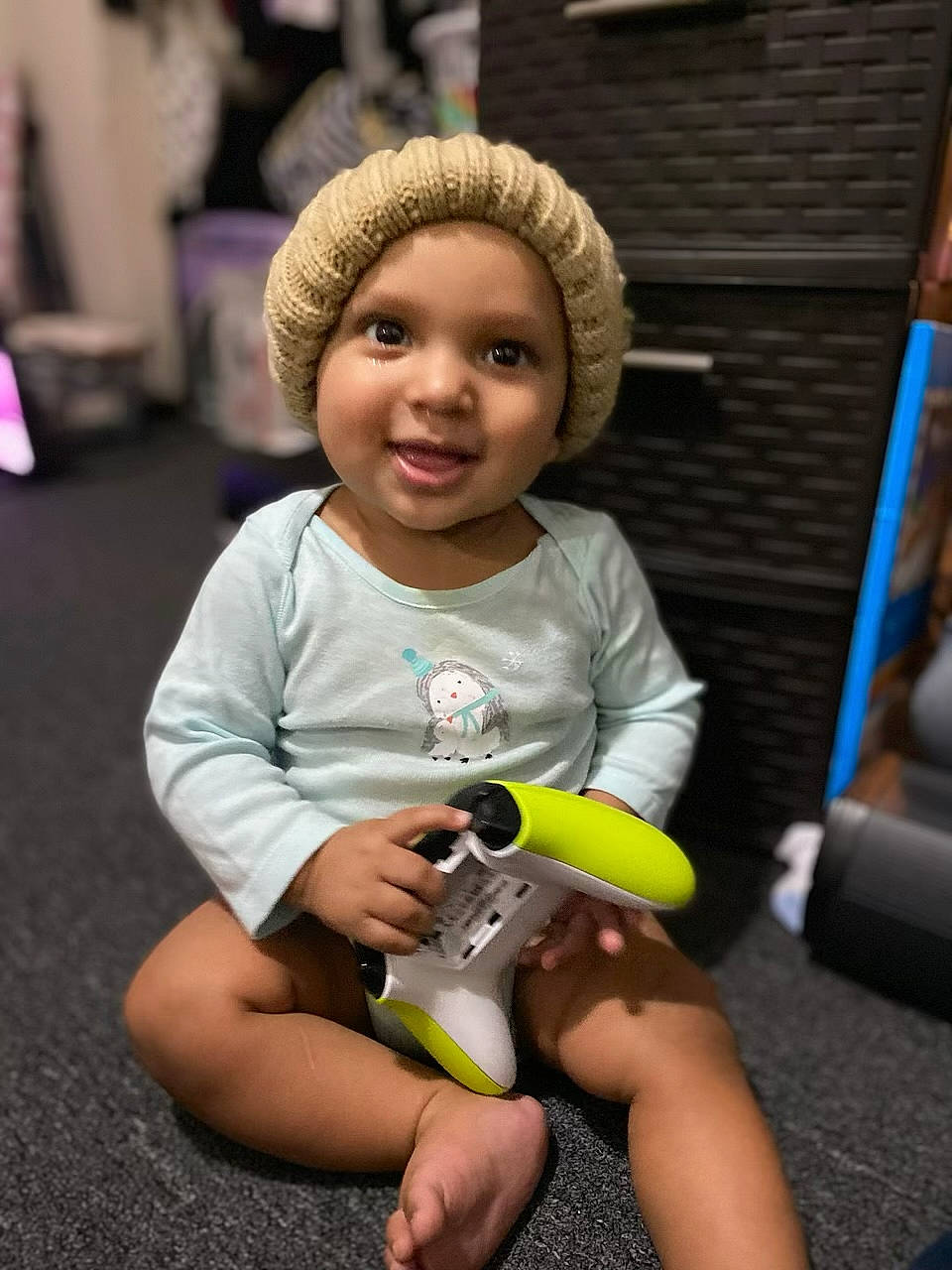 Leland is registered to the contest to win money with this photo: baby, beanie, camera, cameras_optics, cap, child, eye, fun, gadget, happy, headwear, iris, joy, leisure, nail, person, room, sitting, skin, smile