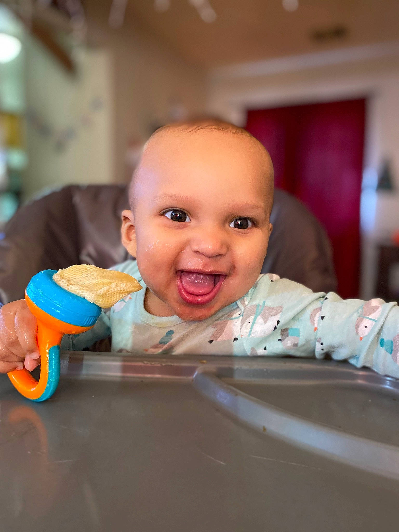 Leland is registered to the contest to win money with this photo: baby, baby_playing_with_toys, baby_products, cheek, child, finger, flooring, fun, happy, iris, leisure, mouth, person, room, sitting, skin, smile, tableware, thumb, toddler