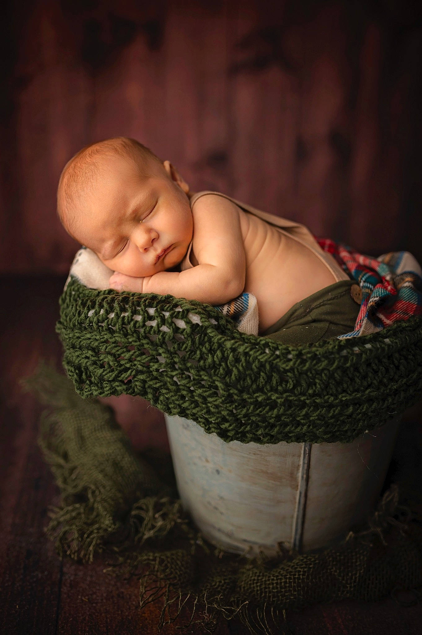 Kane is registered to the contest to win money with this photo: arm, baby, baby_products, baby_toddler_clothing, basket, cheek, child, comfort, darkness, facial_expression, flash_photography, fun, grass, hairstyle, happy, human_body, person, sitting, skin, toddler