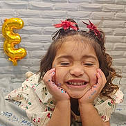 Brooklyn is registered to the contest to win money with this photo: accessories, balloon, bodypart, child, cream, face, female, finger, girl, hand, happy, head, jewelry, number, person, photography, portrait, smile, symbol, text