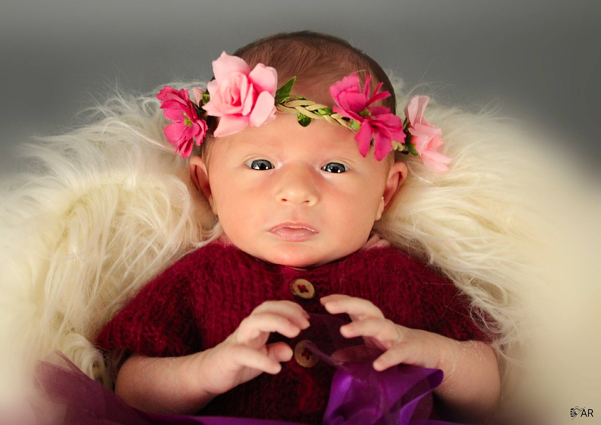 Cloé participe au concours pour gagner de l'argent avec cette photo : baby_toddler_clothing, ear, eye, eyebrow, eyelash, flash_photography, flower, gesture, happy, headband, headpiece, headwear, lip, magenta, person, petal, pink, purple, skin, sleeve