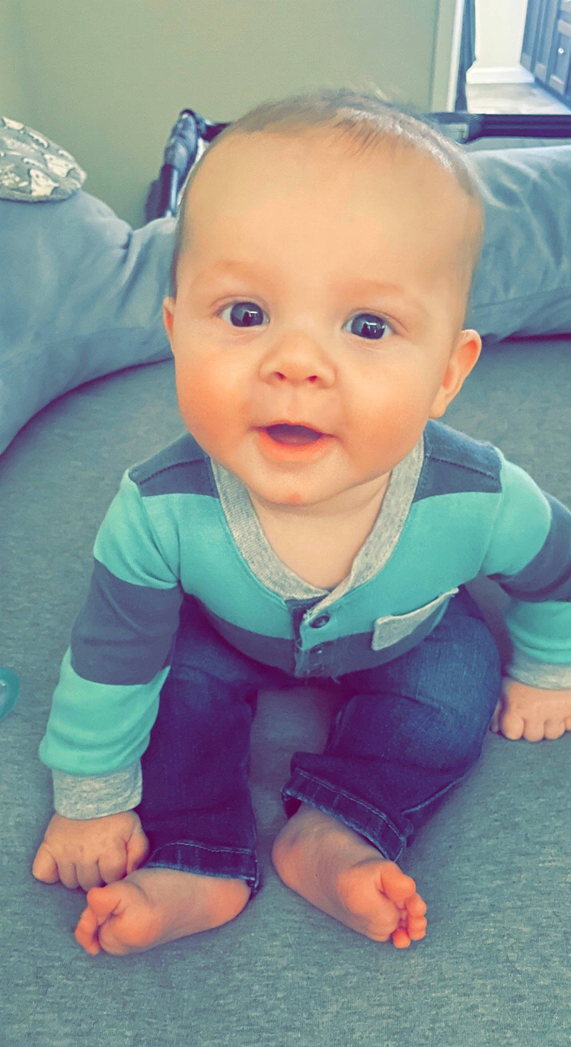 Robbie is registered to the contest to win money with this photo: arm, azure, baby, baby_toddler_clothing, blue, cheek, child, chin, cool, eye, finger, happy, iris, mouth, nose, person, product, skin, sleeve, thumb