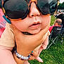 Colsen joined the competition — help win amazing prizes! baby, child, sunglasses, hand, grass, outdoor, people, seated, folding_chair, bracelet, fingernails, footwear, person, summer, daylight, casual, event, curious, closeup, support