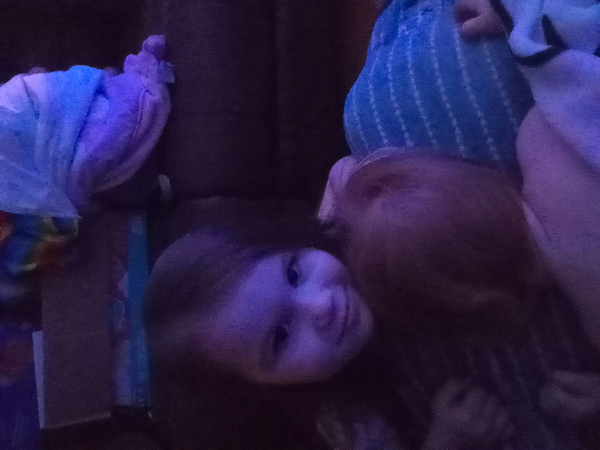 Mindy is registered to the contest to win money with this photo: baby, cap, child, darkness, electric_blue, event, finger, happy, interaction, joy, magenta, mouth, night, person, petal, pink, plant, purple, room, thumb